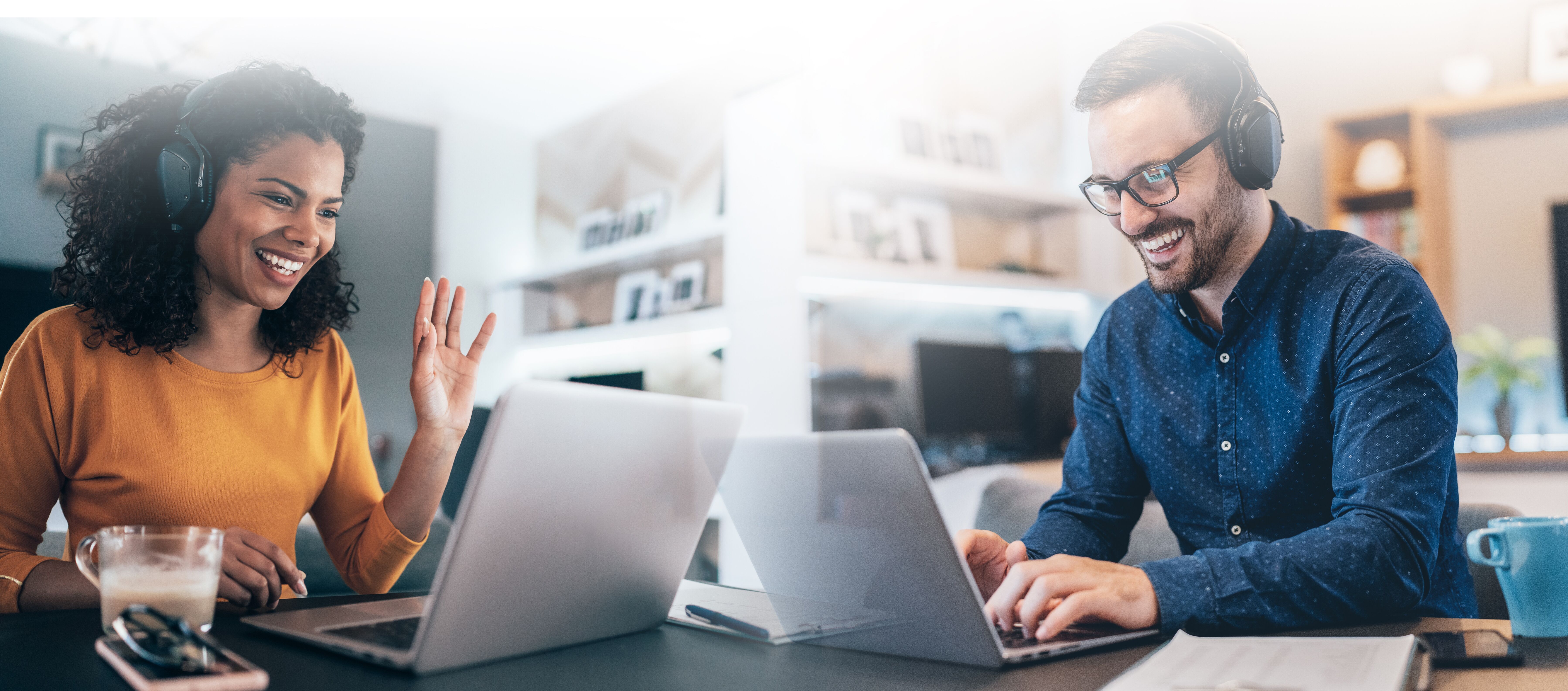 Composite photo of two individuals working remotely.