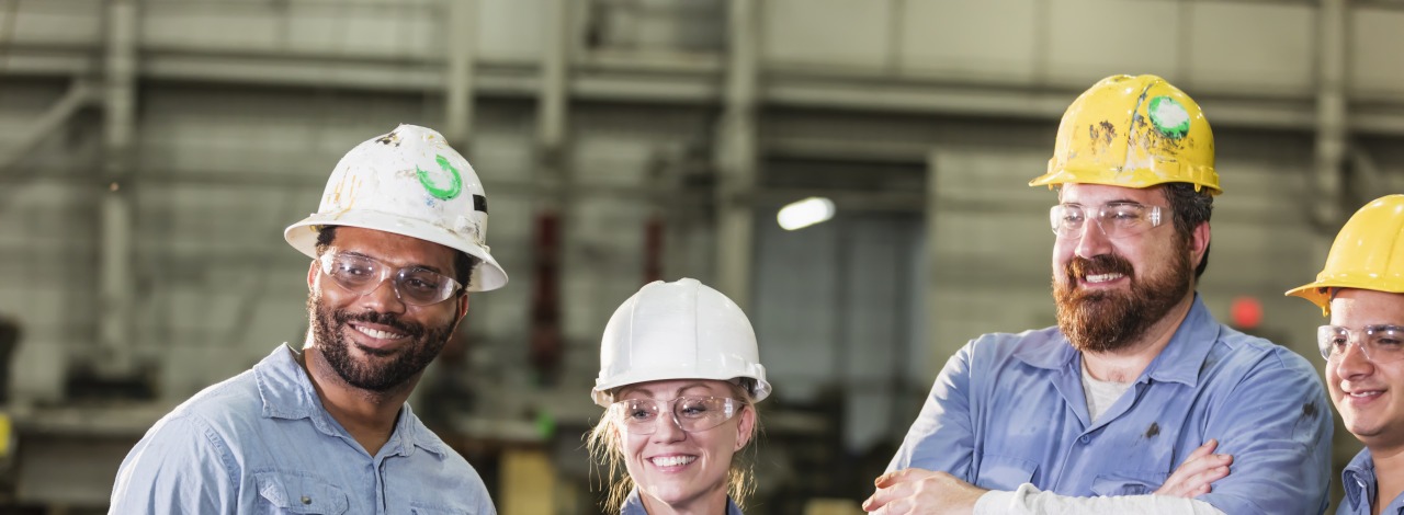 Group of labor workers wearing hard hats